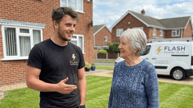Flash Roofing engineer discussing emergency repair with customer
