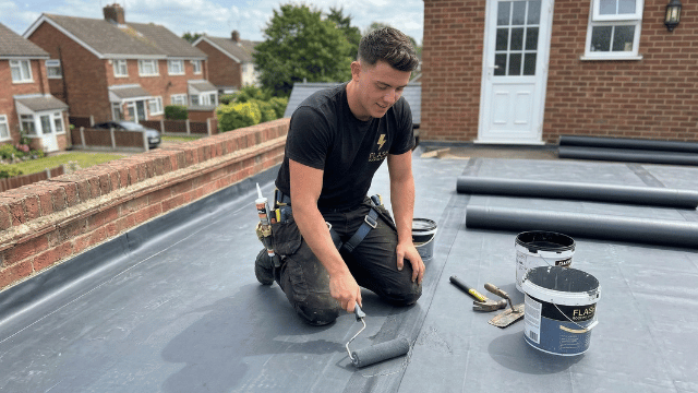 Flash Roofing engineer installing EPDM flat roof membrane