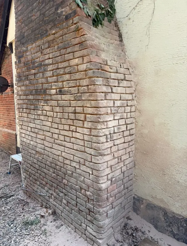 Close up of a freshly repointed brick chimney breast
