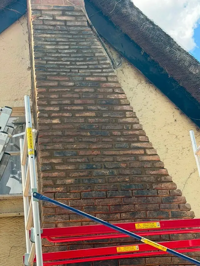 Gable end with a working platform in place for roofline work